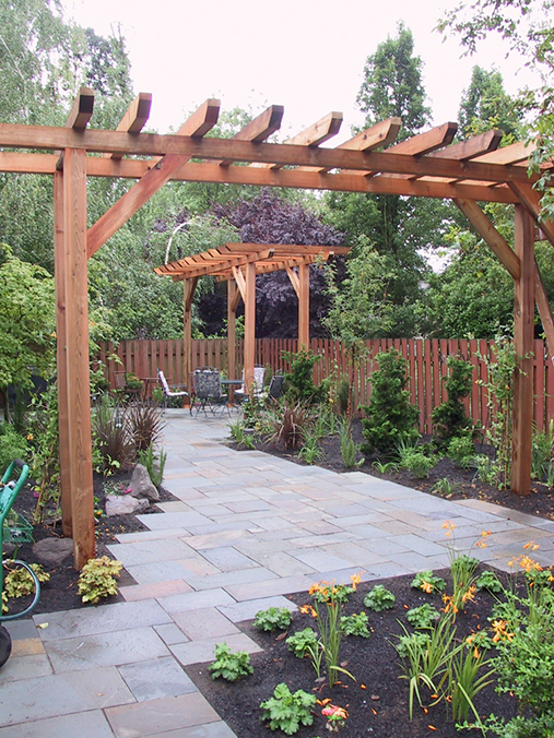 precut bluestone patio with wood trellis