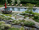 view of garden with pool