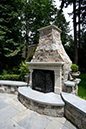 outdoor fireplace with bluestone hearth